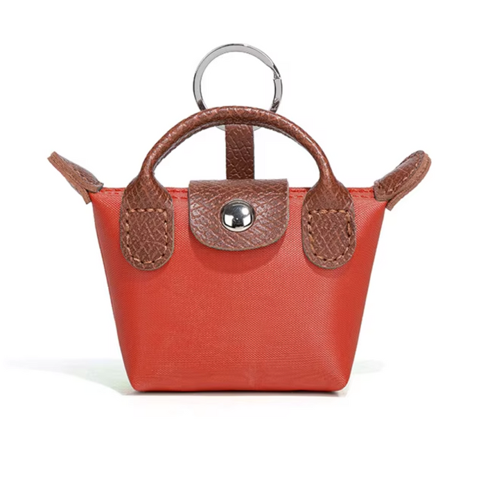 Longchamp 3-in-1 Mini -charm: avaimenperä, AirPods-kotelo & huulipunakotelo