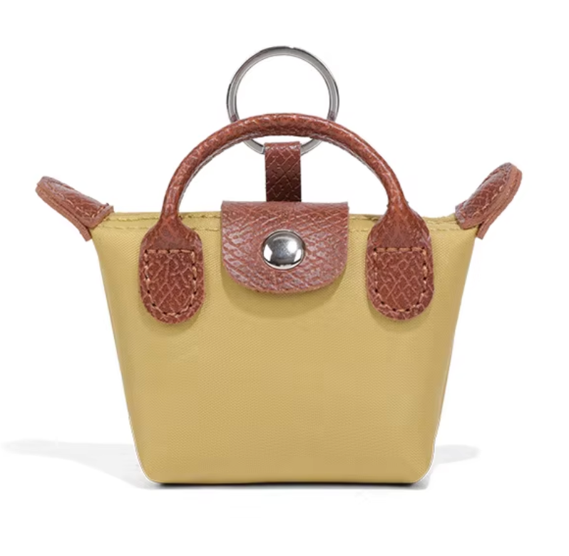 Longchamp 3-in-1 Mini -charm: avaimenperä, AirPods-kotelo & huulipunakotelo