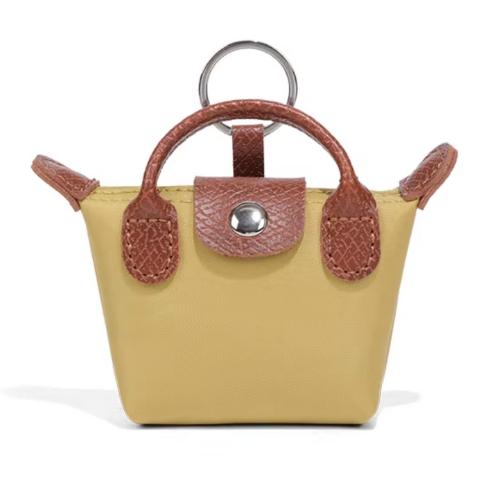 Longchamp 3-in-1 Mini -charm: avaimenperä, AirPods-kotelo & huulipunakotelo