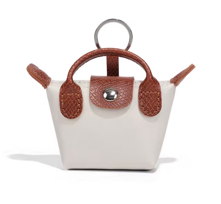 Longchamp 3-in-1 Mini -charm: avaimenperä, AirPods-kotelo & huulipunakotelo